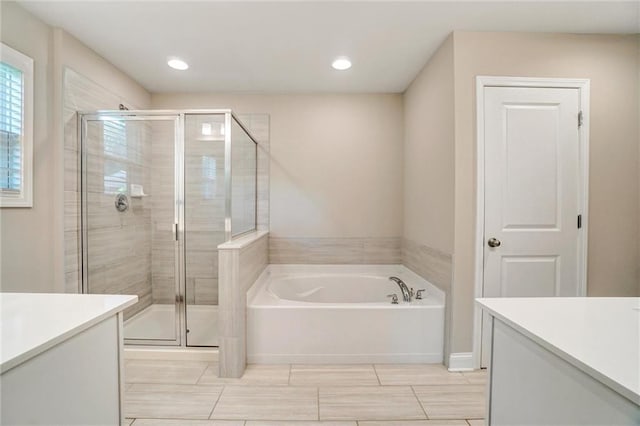 1858 Belmore St SE, Smyrna, GA 30080 - full bath with vanity, a garden tub, a stall shower, and recessed lighting