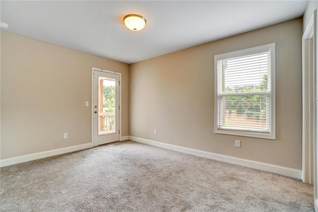 1858 Belmore St SE, Smyrna, GA 30080 - carpeted empty room featuring healthy amount of natural light