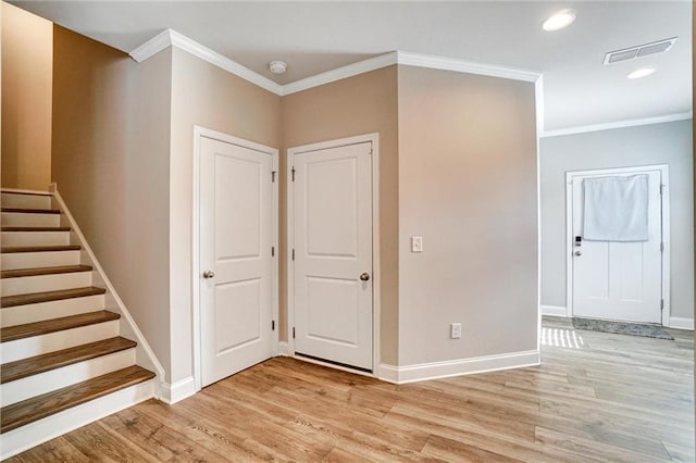 1858 Belmore St SE, Smyrna, GA 30080 - entrance foyer with ornamental molding, light wood-style floors, stairway, and recessed lighting