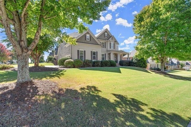 view of front of home with a front lawn