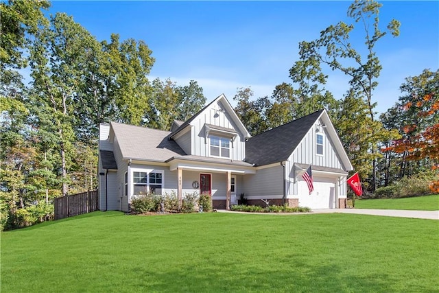 craftsman inspired home with a garage and a front yard