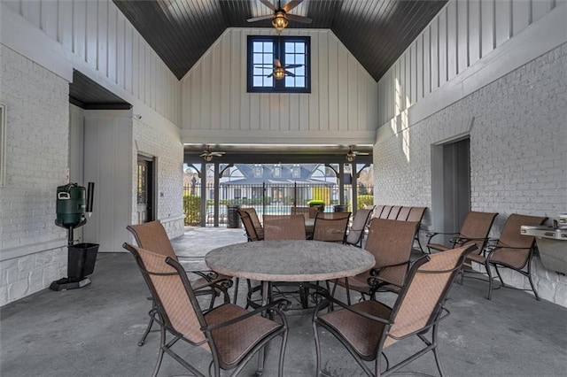 view of patio / terrace with fence, outdoor dining area, and a ceiling fan