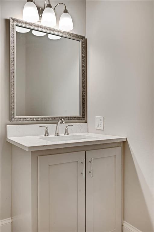 bathroom featuring vanity and baseboards