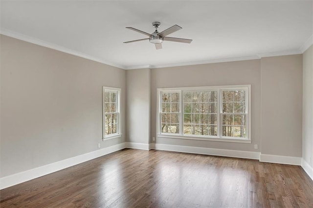 unfurnished room featuring crown molding, baseboards, ceiling fan, and wood finished floors