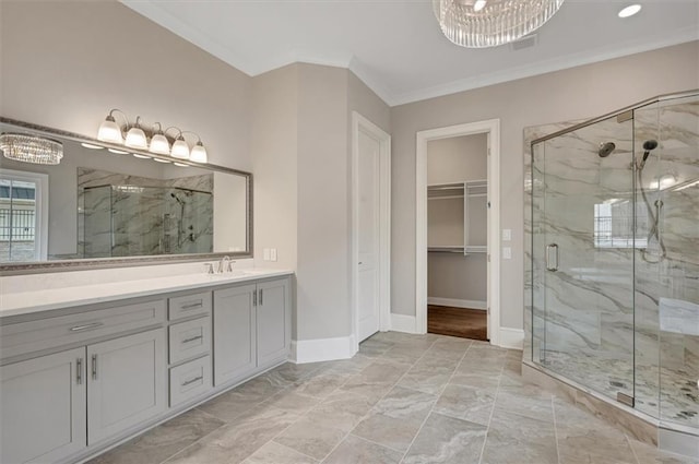 full bathroom with marble finish floor, baseboards, a marble finish shower, and ornamental molding