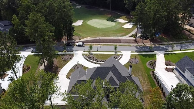 birds eye view of property with view of golf course