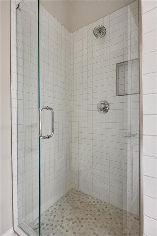 bathroom featuring a shower stall