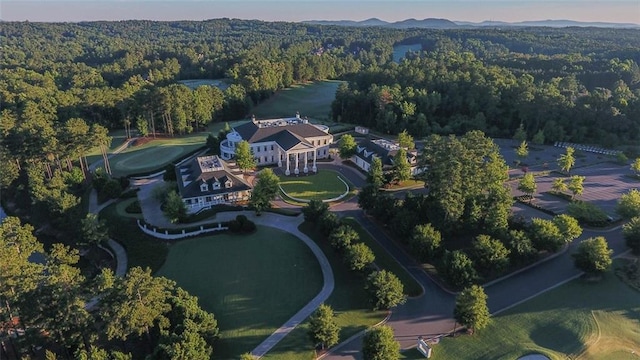 birds eye view of property featuring a wooded view