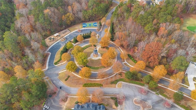 drone / aerial view featuring a forest view