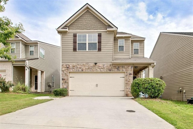 529 Dasheill Ln, Atlanta, GA 30349 - craftsman-style home with an attached garage, stone siding, driveway, and a front lawn