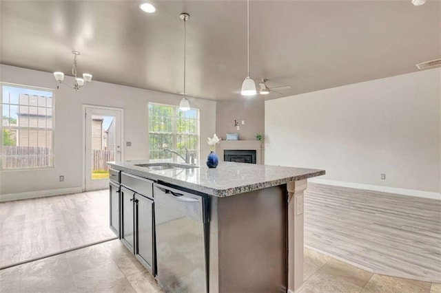 529 Dasheill Ln, Atlanta, GA 30349 - kitchen featuring stainless steel dishwasher, open floor plan, ceiling fan, hanging light fixtures, and lofted ceiling