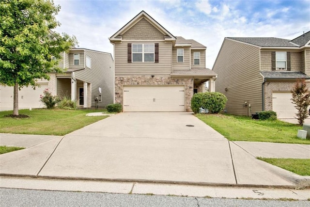 529 Dasheill Ln, Atlanta, GA 30349 - view of front of house featuring an attached garage, a front yard, driveway, and stone siding
