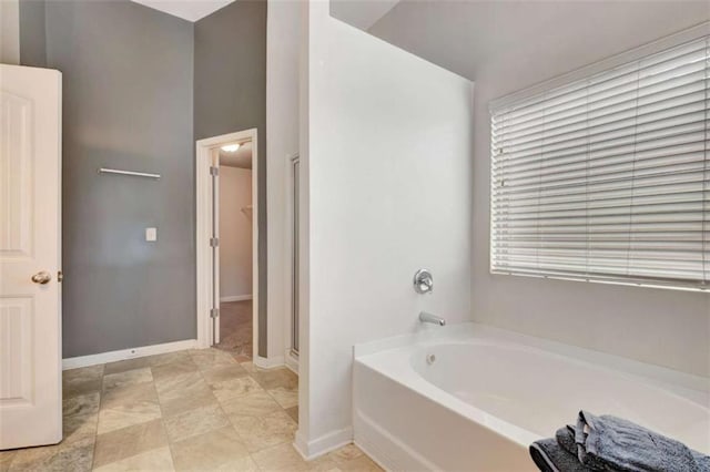 529 Dasheill Ln, Atlanta, GA 30349 - full bath with a bath and a stall shower