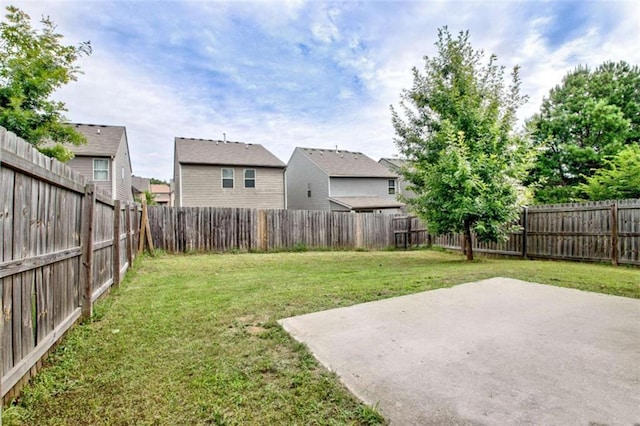 529 Dasheill Ln, Atlanta, GA 30349 - fenced backyard featuring a patio area and a residential view