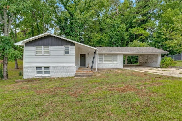 tri-level home with a carport and a front lawn