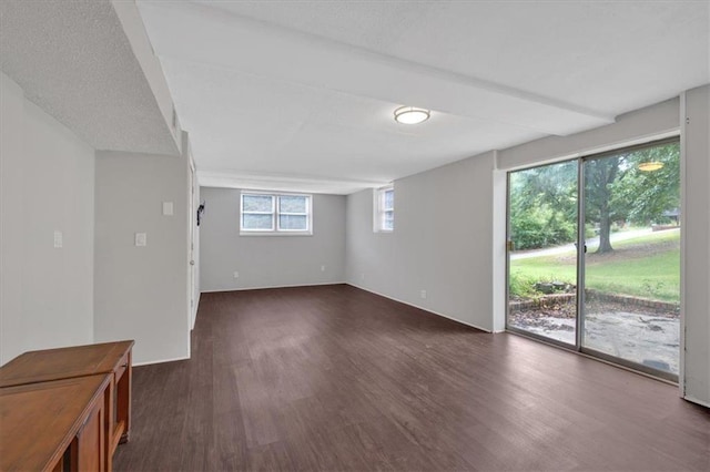 spare room featuring dark hardwood / wood-style flooring