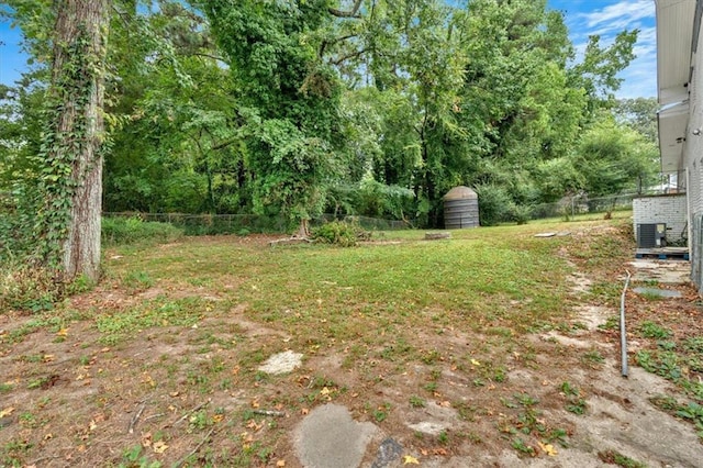 view of yard with central AC