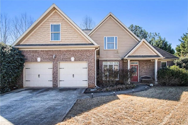 view of front of house featuring brick siding, driveway, and an attached garage