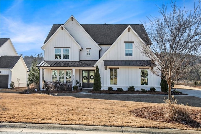 modern farmhouse style home featuring covered porch