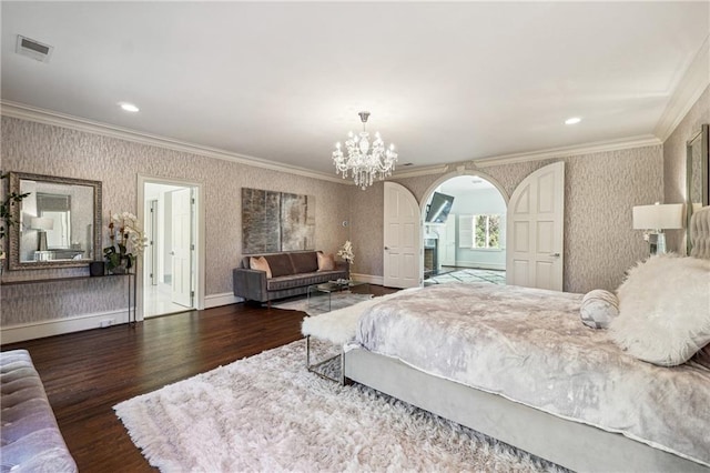 bedroom featuring ornamental molding, wood-type flooring, and a notable chandelier