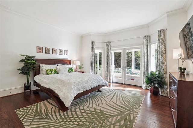 bedroom featuring french doors, ornamental molding, dark wood-type flooring, and access to outside