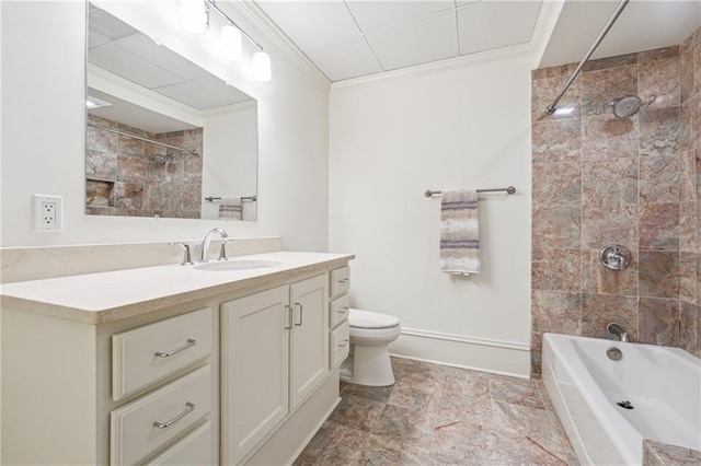 full bathroom with vanity, ornamental molding, toilet, and tiled shower / bath