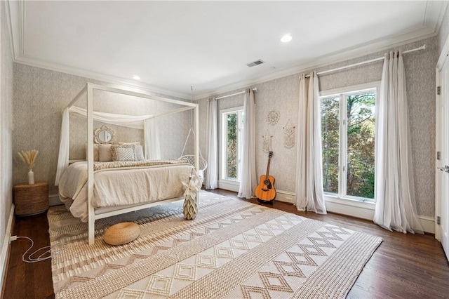 bedroom featuring hardwood / wood-style flooring and ornamental molding