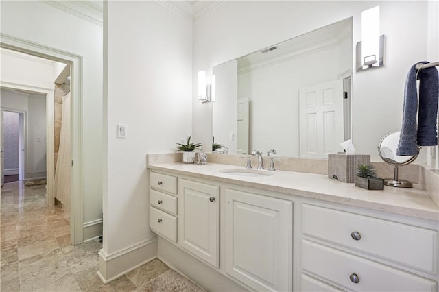 bathroom featuring vanity and ornamental molding