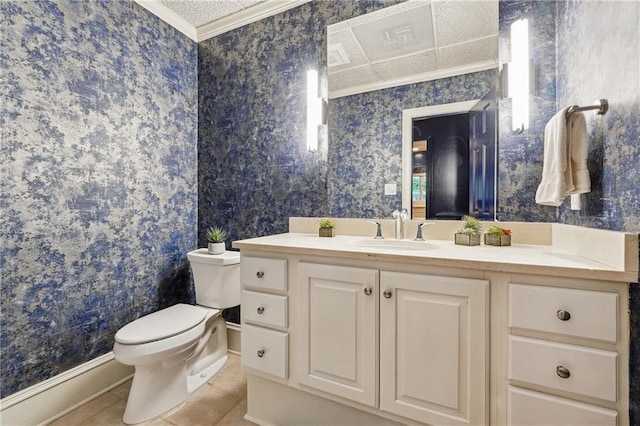 bathroom featuring crown molding, vanity, tile patterned floors, and toilet