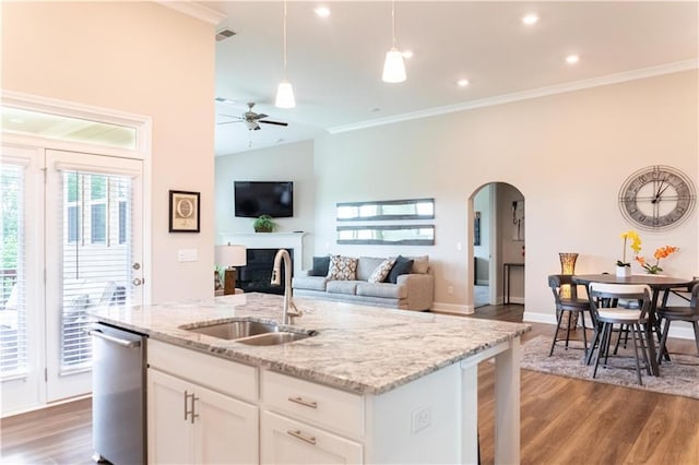 2665 Crowbrook Way, Cumming, GA 30040 - kitchen featuring a sink, dishwasher, arched walkways, a ceiling fan, and wood finished floors