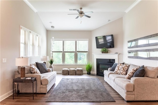 2665 Crowbrook Way, Cumming, GA 30040 - living room with a ceiling fan, a glass covered fireplace, wood finished floors, baseboards, and lofted ceiling