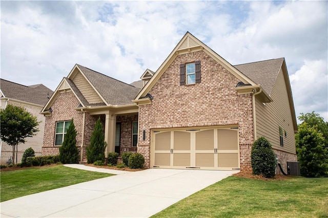 2665 Crowbrook Way, Cumming, GA 30040 - craftsman inspired home featuring brick siding, a front yard, concrete driveway, a shingled roof, and an attached garage