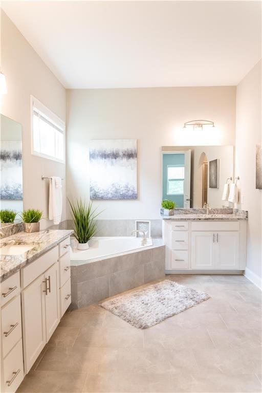2665 Crowbrook Way, Cumming, GA 30040 - full bath with two vanities, a garden tub, and tile patterned floors