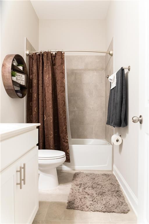 2665 Crowbrook Way, Cumming, GA 30040 - full bathroom featuring vanity, shower / tub combo, toilet, and tile patterned floors
