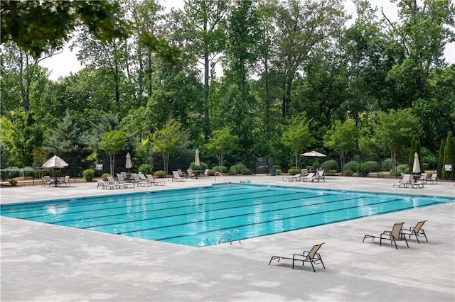 2665 Crowbrook Way, Cumming, GA 30040 - community pool with a patio and view of scattered trees