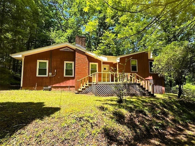 5077 Ada St, Blue Ridge, GA 30513 - back of property with a chimney and a lawn