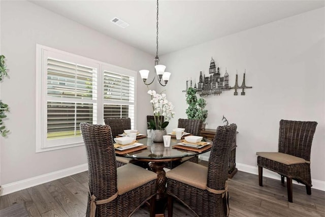 1311 Calgary Lk, Winder, GA 30680 - dining area with a chandelier and wood finished floors