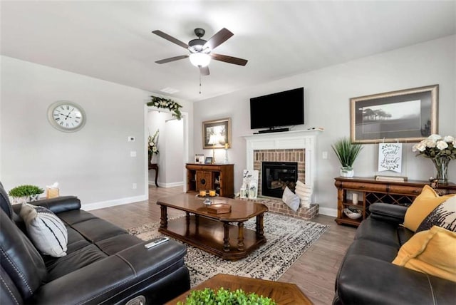1311 Calgary Lk, Winder, GA 30680 - living room with a ceiling fan, a fireplace, and wood finished floors