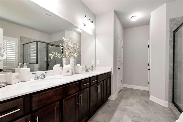 1311 Calgary Lk, Winder, GA 30680 - full bathroom with a shower stall and double vanity