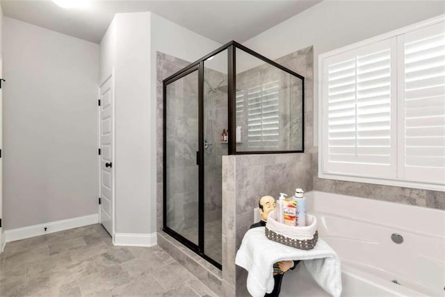 1311 Calgary Lk, Winder, GA 30680 - full bathroom with a bath and a shower stall