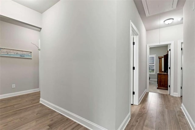 1311 Calgary Lk, Winder, GA 30680 - hallway with attic access and wood finished floors