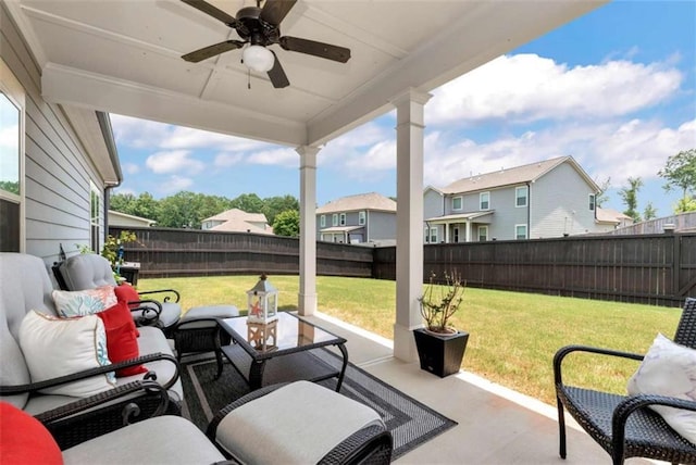 1311 Calgary Lk, Winder, GA 30680 - fenced backyard featuring a ceiling fan, a patio, an outdoor living space, and a residential view