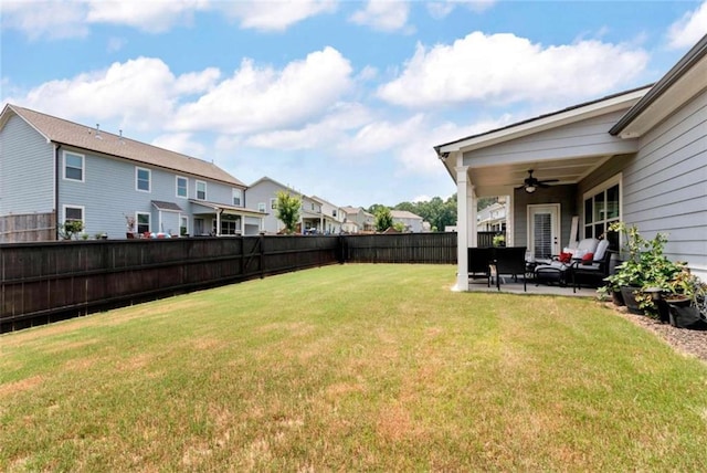 1311 Calgary Lk, Winder, GA 30680 - fenced backyard featuring ceiling fan, a patio, a residential view, and an outdoor living space