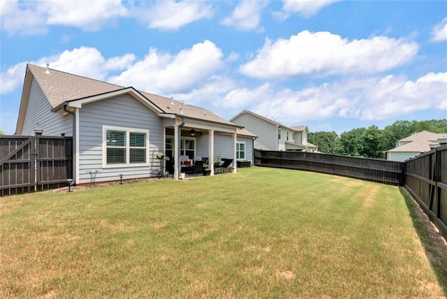 1311 Calgary Lk, Winder, GA 30680 - rear view of house featuring ceiling fan, a fenced backyard, and a patio area