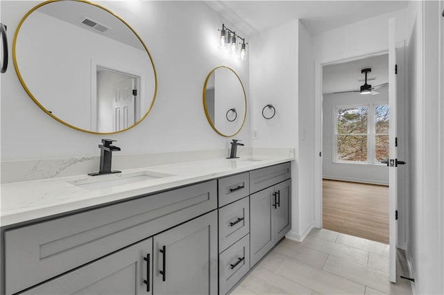 bathroom with ceiling fan, vanity, and tile patterned floors