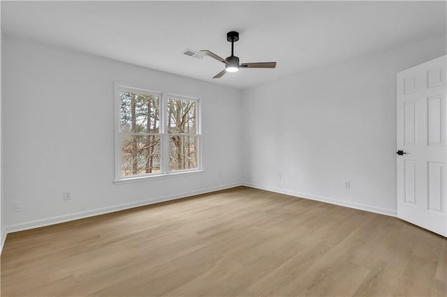 unfurnished room with ceiling fan and light hardwood / wood-style floors