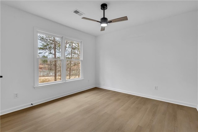 unfurnished room with ceiling fan and light hardwood / wood-style flooring