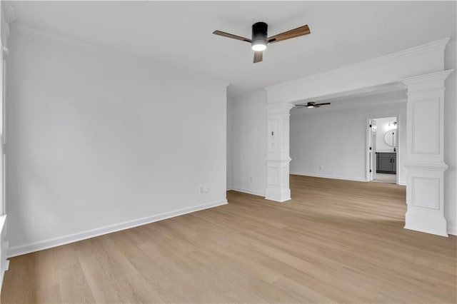 unfurnished room featuring ornamental molding, light hardwood / wood-style floors, ceiling fan, and ornate columns