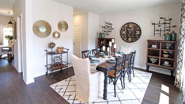 dining room with dark hardwood / wood-style flooring