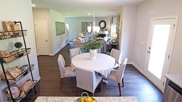 dining area featuring dark wood-type flooring